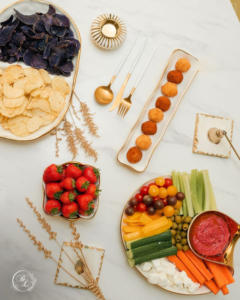 Layla Square Snack Bowl in entertaining spread with snacks and gold serveware — luxury tableware Dubai
