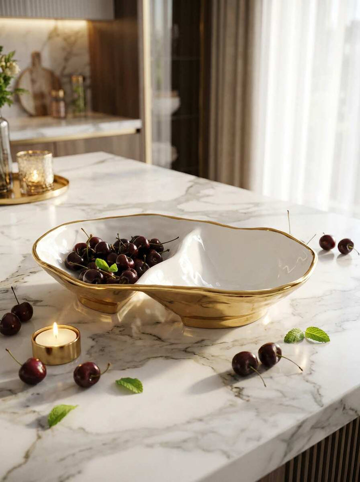 Decorative bowl with cherries on a marble countertop in a kitchen setting